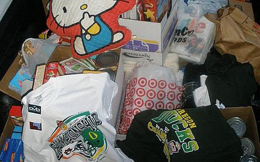 A pile of donations sits at the Toyota of Puyallup dealership on April 11. Seattle-area residents have donated about 200,000 pounds of supplies for orphans in northeastern Japan.