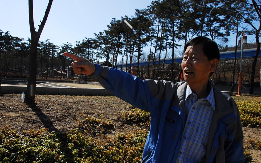 Jang Seok Ju, 73, points to the area where his family used to live in what was then a village on Wolmi Island. The area, bombed by U.S. troops in the days before the Sept. 15, 1950, Incheon Landing, is now a park. "My heart is broken," he said.