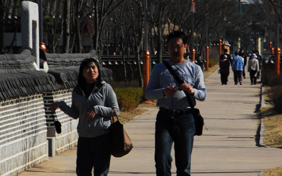 Pedestrians stroll through Wolmi Park, located on an island taken over by North Korean troops in the early days of the Korean War and heavily bombed by U.S. forces in September, 1950.