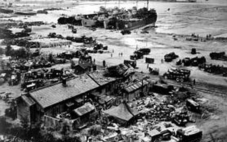 LST&#39;S unloading at Wolmi-do, Inchon, Korea on D-plus and Marine trucks taking supplies to advancing troops.