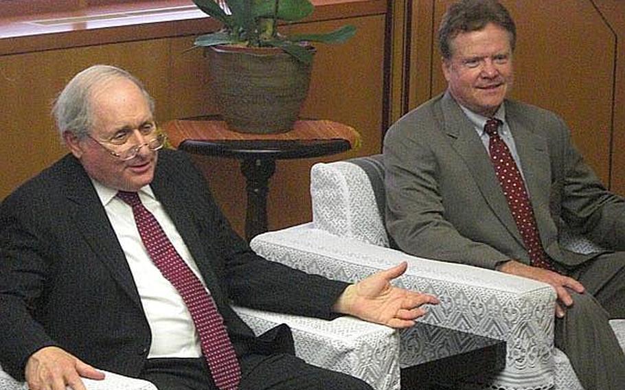 Sen. Carl Levin, D-Mich, left, and Sen. Jim Webb, D-Va., right, speak with Okinawa Gov. Hirokazu Nakaima during a meeting in Naha Wednesday about the Futenma air station relocation.