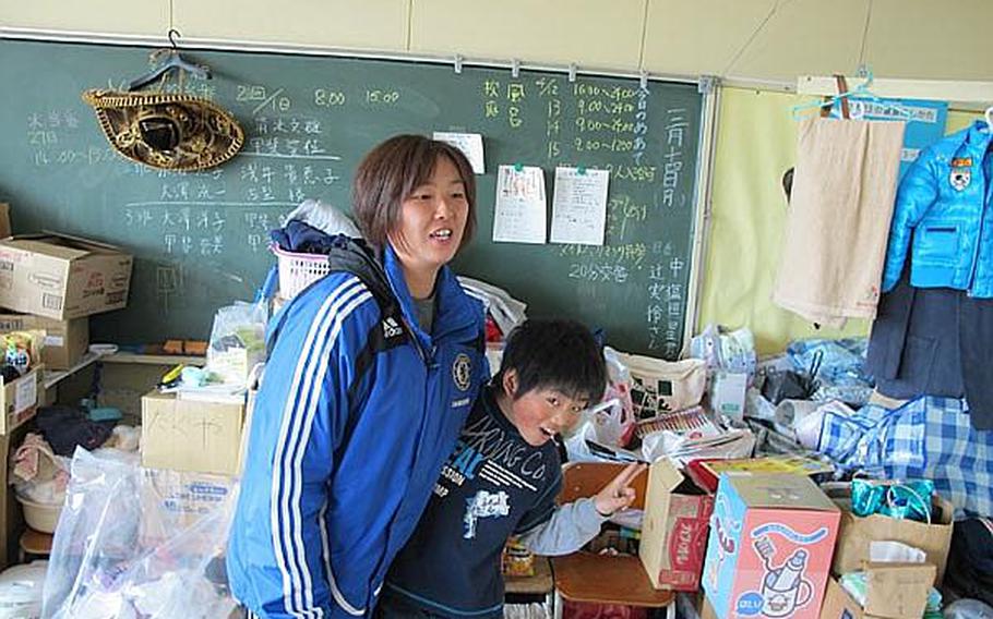Eiji Kai, 10, lives with his mother, Yoshiko, and his brother Aska, 7, in a classroom with other families at Okaido Elementary School in Ishinomaki. Thousands were left homeless in the city following the March 11 tsunami in northeast Japan. Eiji is one of 11 children who both live in and attend class at the school. Educators at the school say they will observe the children closely before discussing the disaster in class.