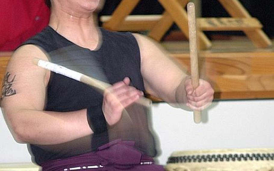 Matthew Bernal, a member of the Dragon-Eagle Taiko drum team, performs Saturday at Misawa Air Base, Japan.