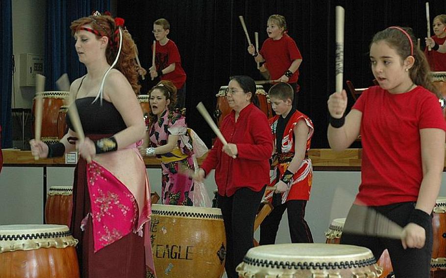 Members of the Dragon-Eagle Taiko drum team perform Saturday at Misawa Air Base, Japan. The team celebrated its 12th anniversary with the performance to raise money for earthquake and tsunami-stricken Japan.