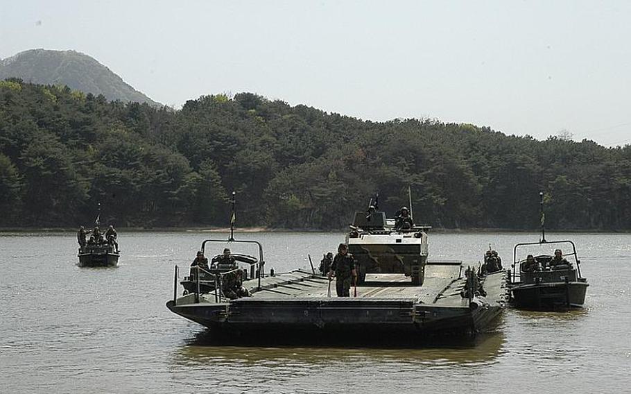 A South Korean V200 is being ferried toward land during a joint U.S.-South Korean military exercise Tuesday at a base 13 miles from the Demilitarized Zone. About 150 soldiers practiced how manpower and equipment would be moved across lakes, rivers and streams in the event hostilities ever resume on the Korean peninsula.