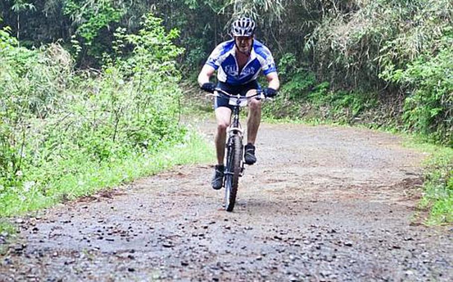 Wade Rowlins pedals up a hill at the Tour de Tama Saturday at Tama Hills Recreation Center.