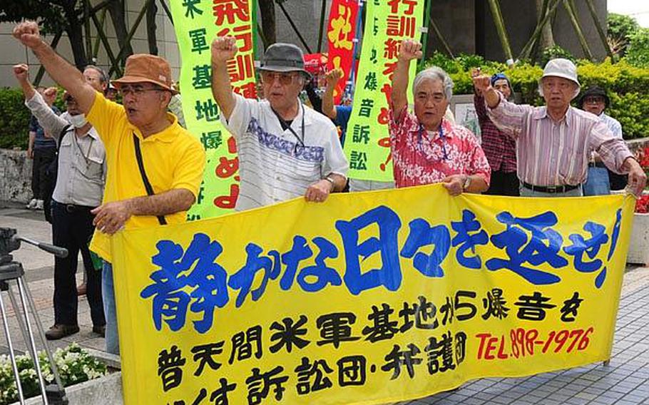 Protesters demonstrate outside the Prefectural Government Office in Naha Saturday, moments before Japanese Defense Minister Toshimi Kitazawa met with Okinawa Governor Hirokazu Nakaima to seek the governor's support for moving Futenma Marine Corps air operations to Camp Schwab.