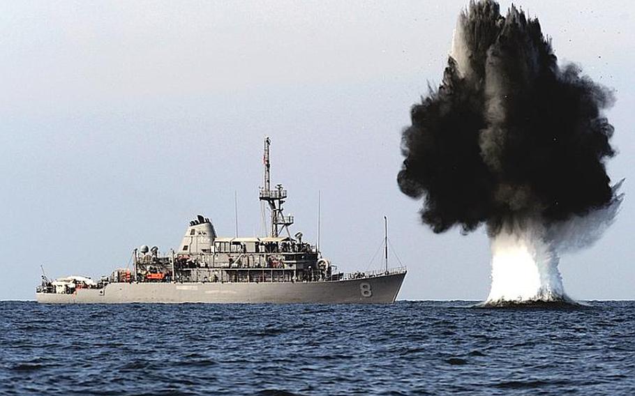 A demolition charge detonates 1,500 meters from the Avenger-class mine countermeasures ship USS Scout. The charge was built and detonated by sailors assigned to Explosive Ordnance Disposal Mobile Unit 1 and Mobile Diving and Salvage Unit 2, attached to Combined Task Group 56.1, during joint mine countermeasures training. 