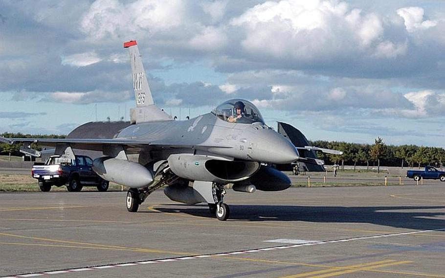 A 13th Fighter Squadron pilot taxis his F-16 on the flight line at Misawa Air Base, Japan, in May 2011.