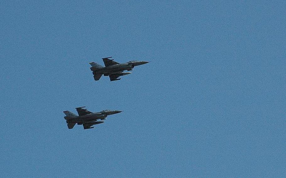 Two F-16s from the 13th Fighter Squadron roar above Misawa Air Base, Japan, on Friday as they return from deployment to Joint Base Balad, Iraq.