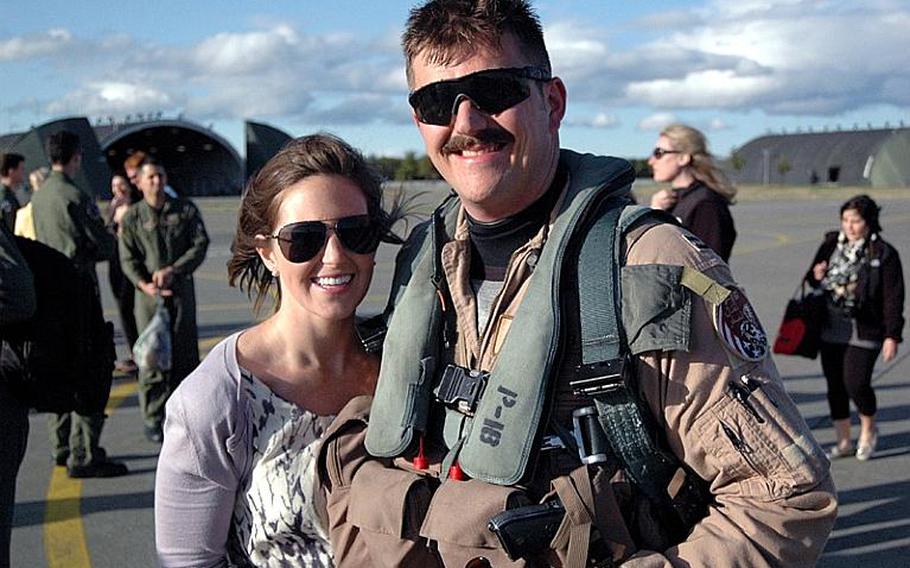 Capt. Matthew Hoyt and his wife, Danielle, enjoy being reunited Friday at Misawa Air Base, Japan. Hoyt and other members of the 13th Fighter Squadron returned from deployment to Joint Base Balad, Iraq.
