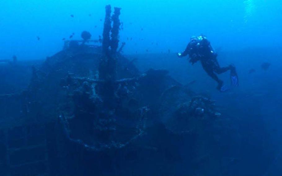 A diver swims over the USS Emmons shipwreck off the coast of Okinawa in September 2009.