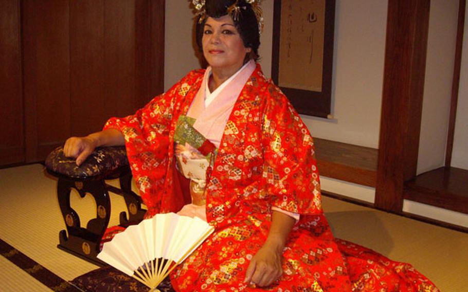 Quintana poses wearing traditional Japanese attire.