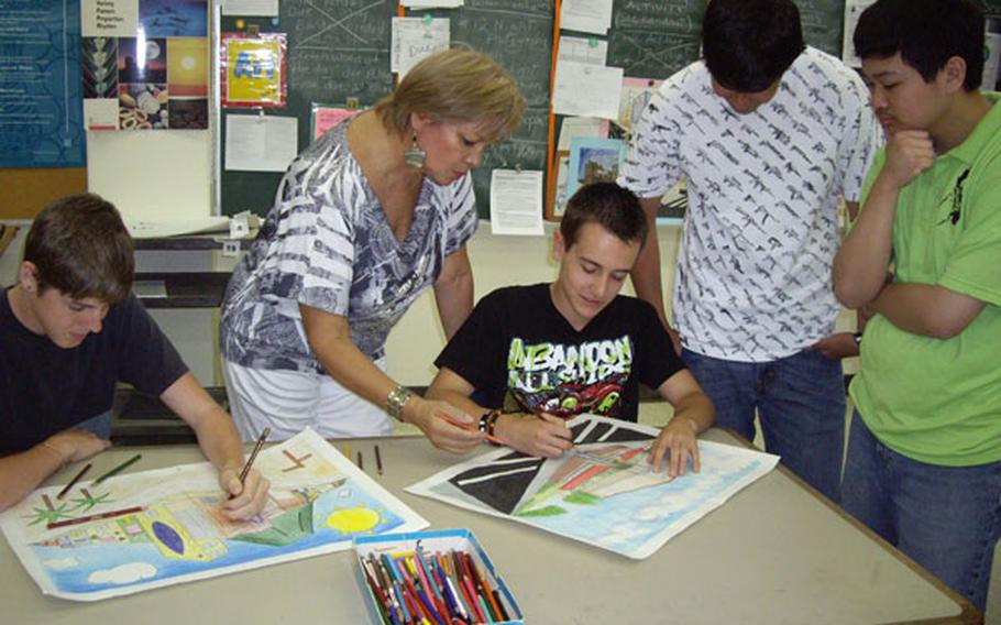 Quintana instructs 10th grader Zack Lewis as other students watch.