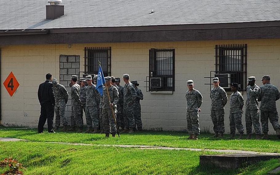 Soldiers at Camp Carroll stand at parade rest on a recent afternoon. The small Waegwon base has been at the center of a growing controversy since last month, when three former soldiers said last month that they helped bury Agent Orange near the base's helipad in 1978.