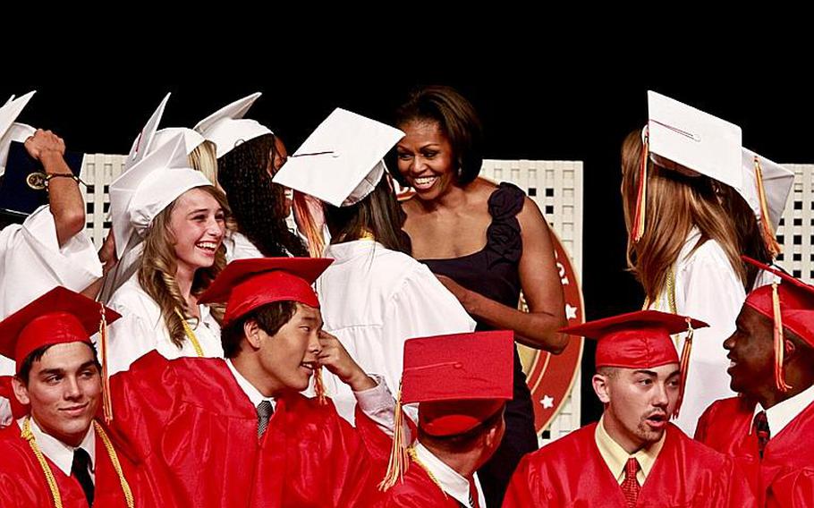 First lady Michelle Obama chats with the 2011 graduates of Quantico Middle/High School on Marine Corps Base Quantico, Va., June 3, 2011. The first lady gave the commencement address to the 36 graduates, including nine from Japan who relocated after the earthquake and tsunami earlier this year.