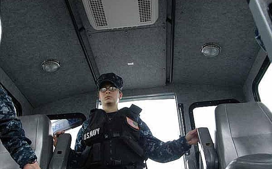 Seaman Apprentice Corrine Roberts remains vigilant while patrolling the harbor near Sasebo Naval Base, Japan, in mid-June.