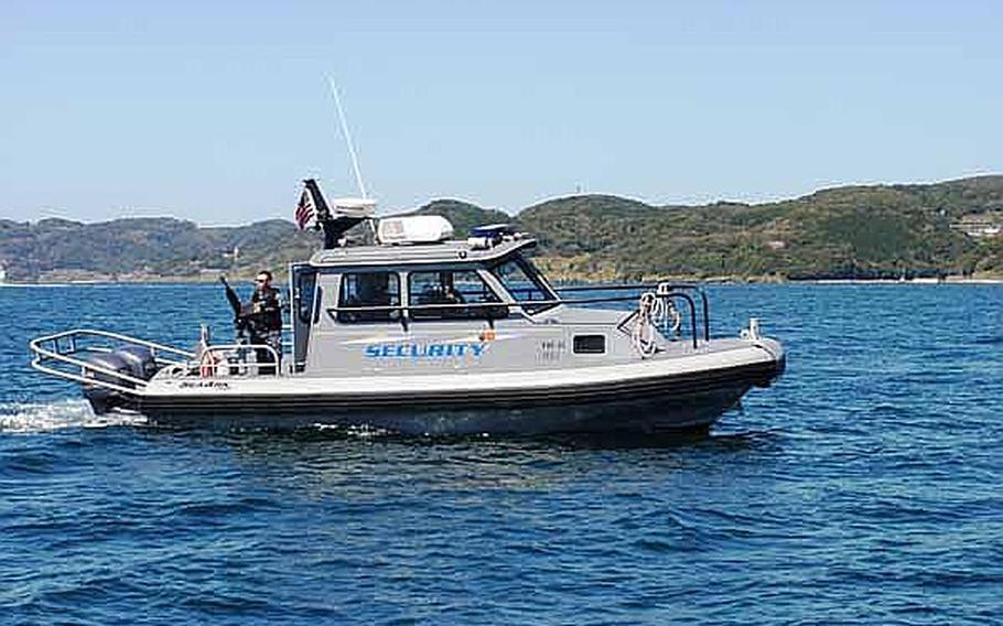 A harbor security vessel patrols the waters around Sasebo Naval Base, Japan. The harbor security team is responsible for keeping the U.S. Navy assets in the area safe.