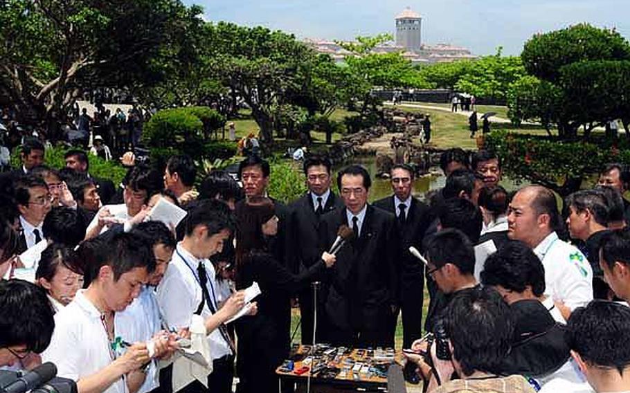 Prime Minister Naoto Kan talks to reporters after a memorial service held at Peace Prayer Park concluded, Thursday. The annual memorial ceremony takes place on June 23 to mark the anniversary of the end of the Battle of Okinawa.