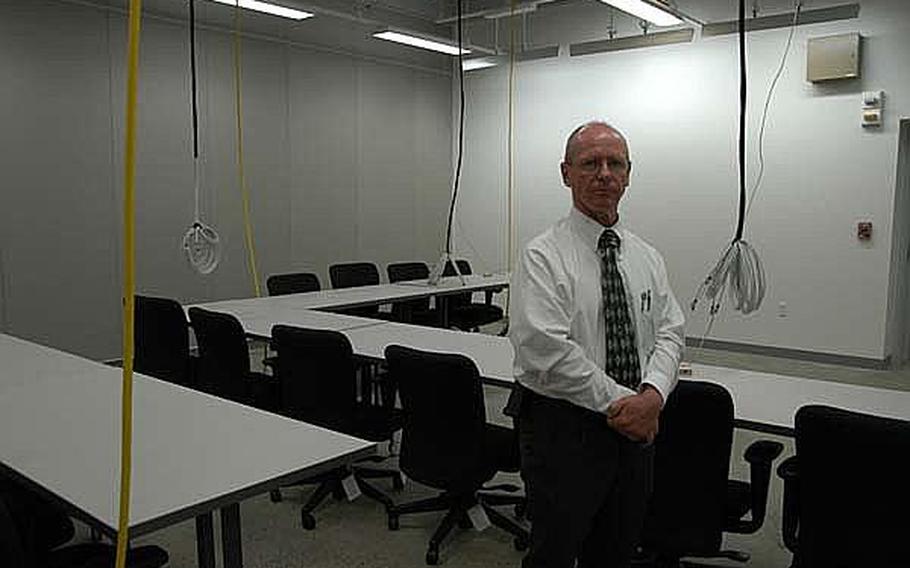 Sagami Mission Command Training Center  director Hal Ayrton, 51, showed off an area at the new facility that can be configured as a Tactical Operation Center last Friday.