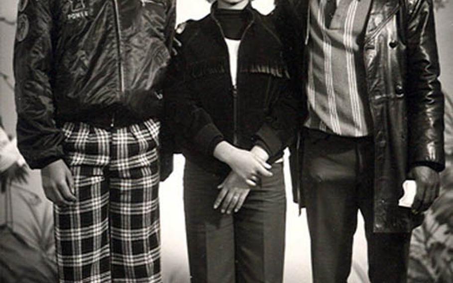 Ronald Lewis, left, stands next to Kim In-soon in a photo from the early 1970s when Lewis was a U.S. Army soldier stationed in South Korea and he befriended Kim, a girl dealing with prejudice against mixed-race people like herself. Kim grew up to become a famous singer in South Korea, and after years of trying to locate Lewis, she plans to reunite with him in person this weekend.