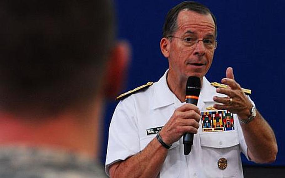 Adm. Mike Mullen, chairman of the Joint Chiefs of Staff, answers a question Thursday posed by a soldier at U.S. Army Garrison-Yongsan. Mullen told troops and reporters that future attacks by North Korea remain possible.