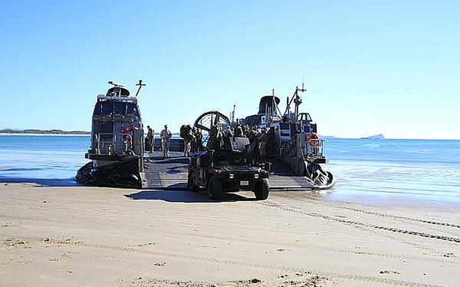 A Landing Craft Air Cushion from Assault Unit 5 lands on Freshwater Beach, Australia, as part of an amphibious assault during Talisman Sabre 2011. TS11 is an exercise designed to train U.S. and Australian forces to plan and conduct Combined Task Force operations to improve combat readiness and interoperability on a variety of missions, from conventional conflict to peacekeeping and humanitarian assistance efforts.