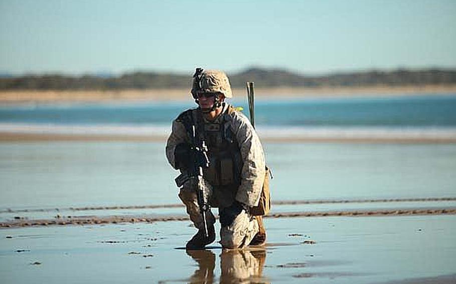 A U.S. Marine secures Freshwater Beach during an amphibious assault as part of Talisman Sabre 2011 exercise in Austrialia.