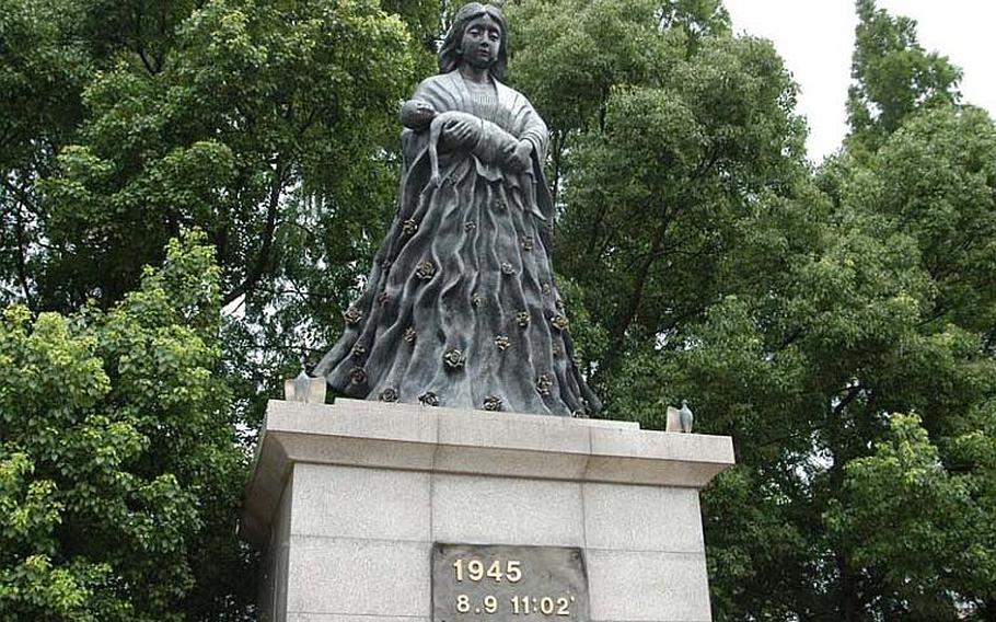 A statue of a mother holding an ailing child at ground zero, a short distance from the Nagasaki Peace Park where Tuesday's ceremony was held.