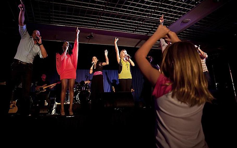 Contestants from various seasons of American Idol sing for fans Wednesday night during a free performance at Yokota Air Base.