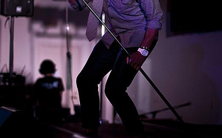 Past contestant on American Idol Jimmie Allen belts out tune during a free concert Wednesday night at Yokota Air Base. Allen and a handful of other Idol contestants are visiting Pacific bases over the next few days.