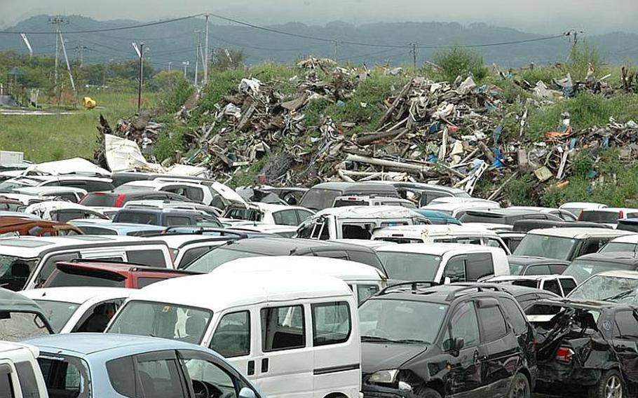 Piles of twisted metal and a field full of wrecked cars still greet people arriving at Sendai Airport but the camp that was home to soldiers and Marines and the stench from massive piles of rotting debris are long gone.