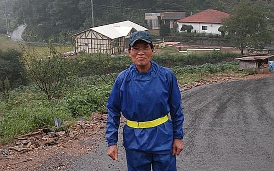 Kim Jong-whan, 72, walks up the road that snakes through Golsandong in South Korea and connects the 50 homes there. Kim has lived in the village since it was moved to a valley east of Camp Casey 60 years ago and says residents have benefitted from Golsandong&#39;s relationship with the adjacent U.S. base.