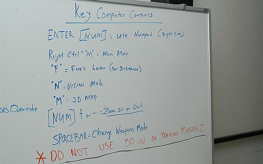 Some computer control instructions are spelled out on a board in an auditorium where Camp Casey-based soldiers in South Korea took part in video game-like training in August 2011. Officials said that by training on laptops, soldiers are better prepared when they start practicing in actual fighting vehicles.