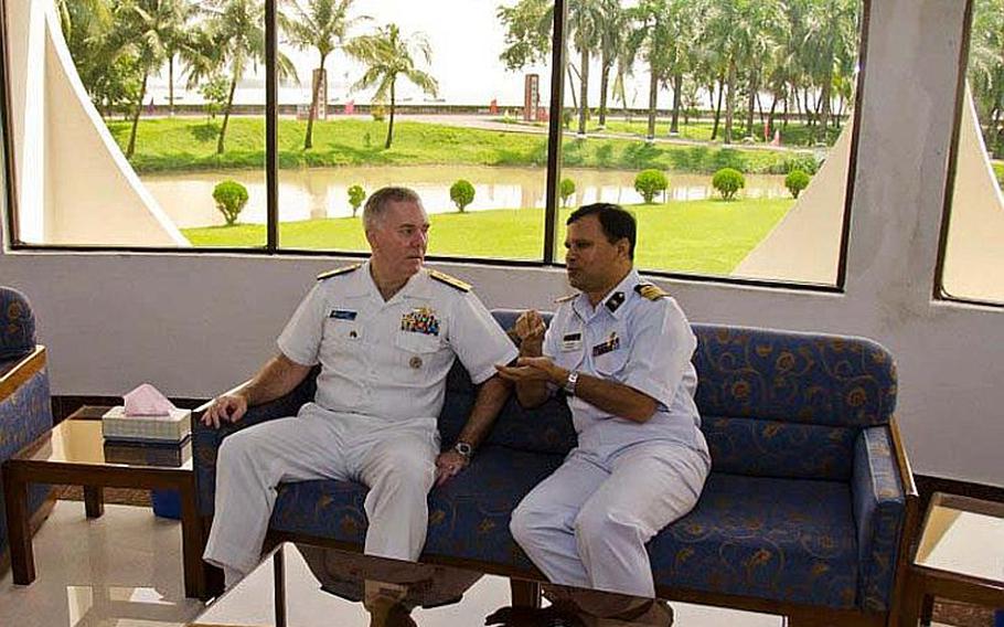 Rear Adm. Tom Carney, commander of Task Force 73, left, meets with Capt. Aslam Parvez of the Bangladesh Navy during Cooperation Afloat Readiness and Training (CARAT) Bangladesh 2011. CARAT is a series of bilateral exercises held annually in Southeast Asia to strengthen relationships and enhance force readiness, and Bangladesh is taking part in this exercise for the first time.