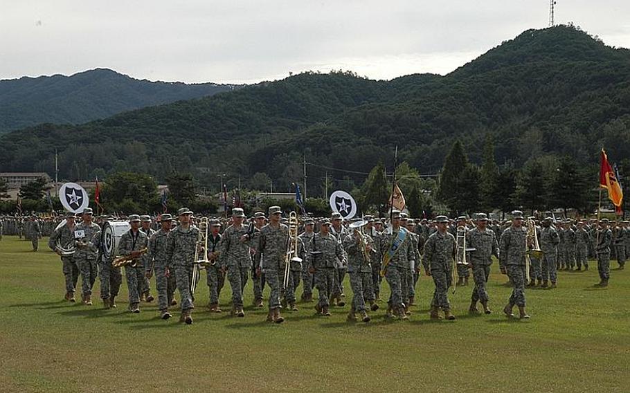 The 2nd Infantry Division Band marches during a change of command ceremony Tuesday at Camp Casey in South Korea. Maj. Gen. Edward Cardon succeeded Maj. Gen. Michael Tucker as commander of the division.