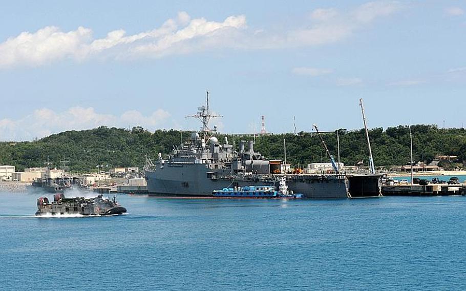 A Landing Craft Air Cushion vehicle prepares to embark on the Amphibious Transport Dock ship USS Denver that is moored at West Army Pier in Okinawa Japan Friday. Denver is part of the Essex Amphibious Ready Group, which is currently on patrol in the western Pacific.