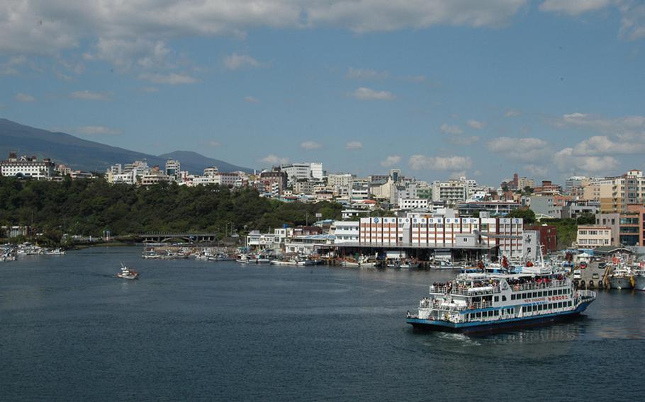 A cruise ship heads out to sea from Jeju Island in South Korea, just miles from the site of a controversial naval base under construction and scheduled to open in 2015.