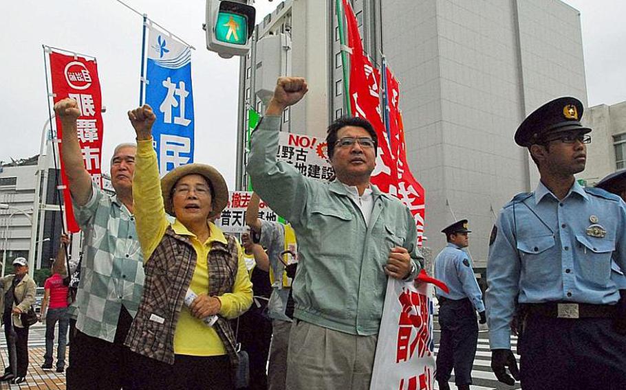 Residents gather around the Okinawa prefectural office in Naha on Oct. 17, 2011, to protest the Futenma air station during a visit by newly appointed Defense Minister Yasuo Ichikawa.