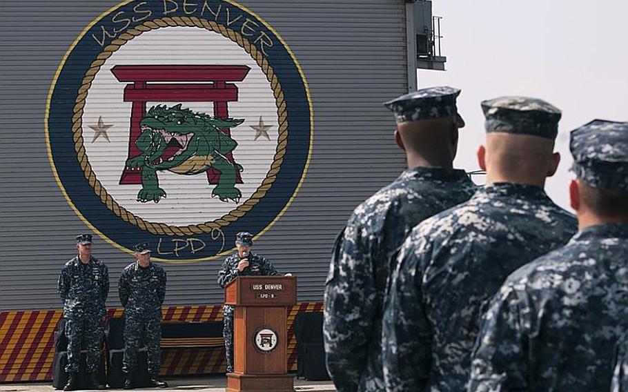 Capt. Michael Wettlaufer, new commanding officer of the forward-deployed amphibious transport dock ship USS Denver, gives a speech to the crew during the change of command ceremony Oct. 18, 2011. 