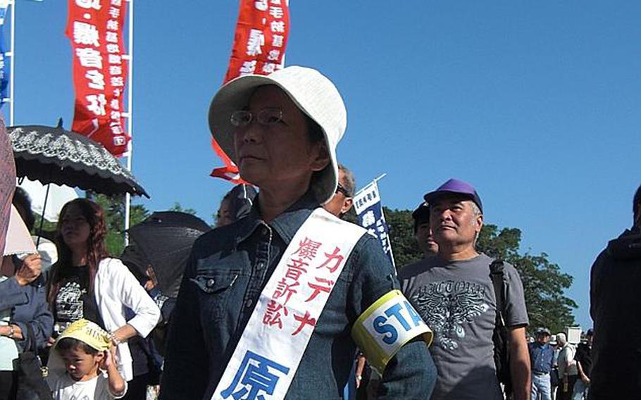 Yoko Nakasone, 56, is among 300 residents and their protesters who gathered Oct. 20, 2011, to support a class-action lawsuit filed against the Japanese government over aircraft noise from Kadena Air Base. Nakasone is one of the 22,058 plaintiffs. She said that her 87-years-old mother had joined in the first lawsuit involving noise at the air base, which was filed in the 1980s. "Residents have been constantly exposed to the noise, and the situation never changes. That's why I joined in the lawsuit," she said.
