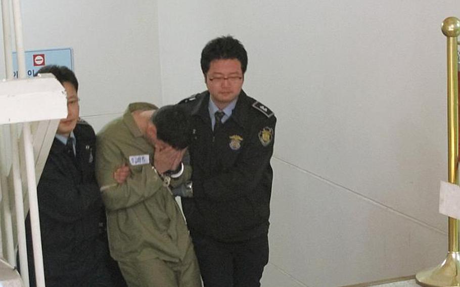 Pvt. Kevin Lee Flippin leaves the Uijeongbu courthouse following the first day of his trial Oct 21, 2011. Flippin confessed to raping, beating and burning a 17-year-old South Korean girl after a night of drinking in Dongducheon on Sept. 24. 

