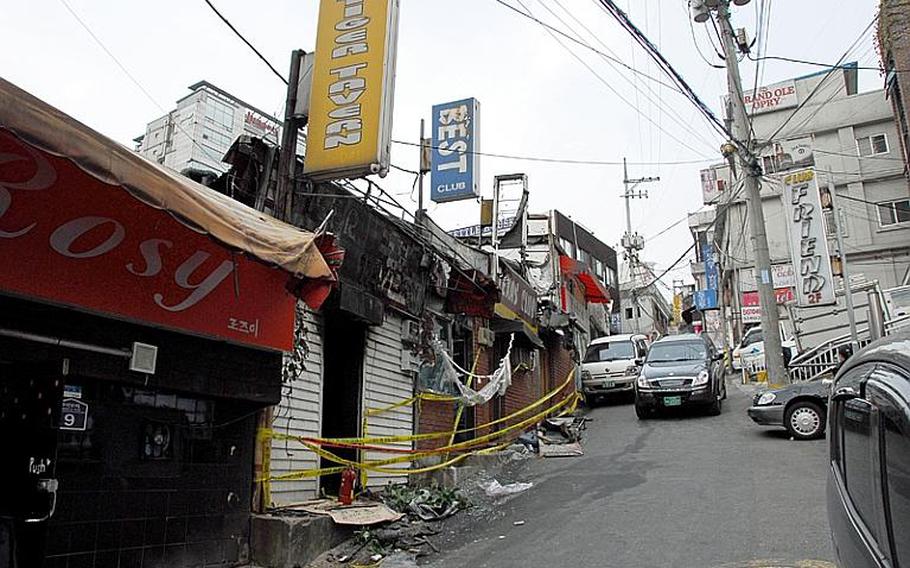 A U.S. soldier allegedly started a fire on Tuesday morning inside Tiger Tavern, a club on Itaewon's Hooker Hill, that spread to three adjacent businesses, all shown here. The tavern was placed off-limits to U.S. troops in 2003 because of its suspected involvement in prostitution and human trafficking.