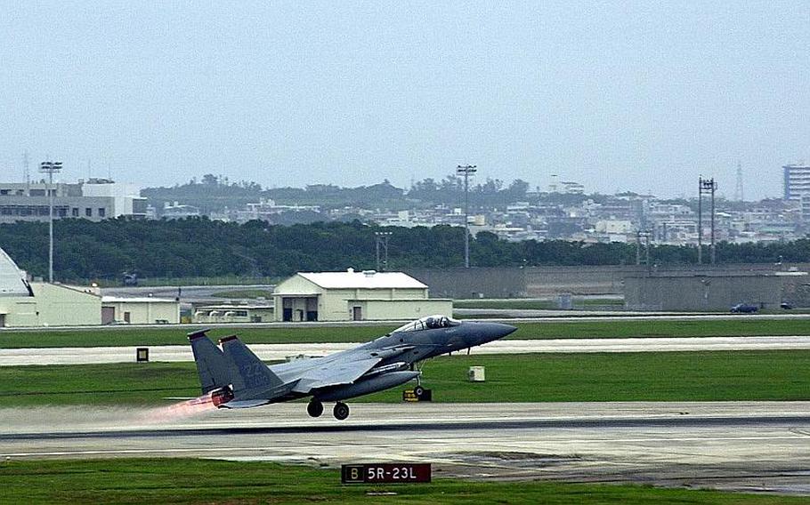 An F-15 Eagle, one of 54 stationed at Kadena Air Base, takes off Dec. 2, 2011. Congress wants to study whether flight operations from Marine Corps Air Station Futenma can also be moved to the air base.