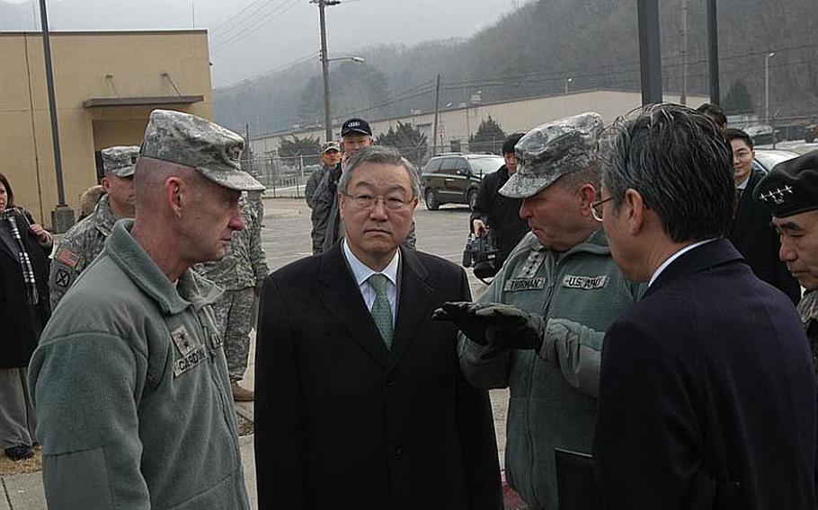 U.S. Forces Korea commander Gen. James Thurman, center, talks Friday with South Korea Foreign Minister Kim Sung-hwan, second from left, at Camp Casey in South Korea. Looking on are 2nd Infantry Division commander Maj. Gen. Edward Cardon, left, U.S. ambassador to South Korea Sung Y. Kim, second from right, and deputy commander of South Korea-U.S. Combined Forces Command Gen. Kwon Oh-sung, right. The foreign minister came to Camp Casey on Friday to thank U.S. troops for their service in South Korea.