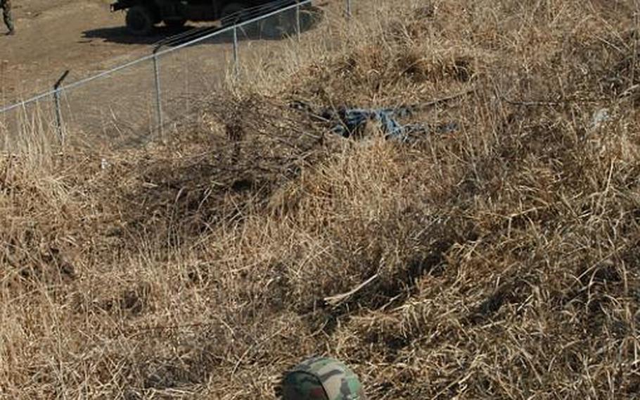 A South Korean soldier takes position Thursday during a live-fire exercise near Rodriquez Range on the peninsula. The drill was part of Foal Eagle, the largest joint military exercise staged each year by the U.S. and South Korean militaries.