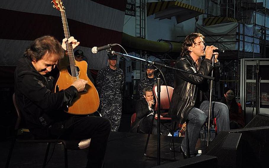 Guitarist Brent Look, left, and Creed singer Scott Stapp entertain sailors and thier families aboard the USS George Washington in Yokosuka, Japan, on March 18, 2012. Stapp and his entourage thanked the servicemen and women for their relief efforts after the 2011 tsunami.