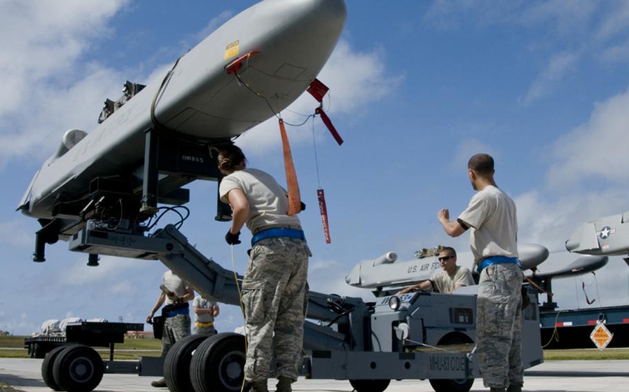 Airmen inspect a Conventional Air-Launched Cruise Missile during a Combat Ammunition Production Exercise at Andersen Air Force Base, Guam on April 23, 2012. During the exercise, some 20 inspectors evaluate the airmen&#39;s processes and procedures for building munitions to support the wing&#39;s operational plan.