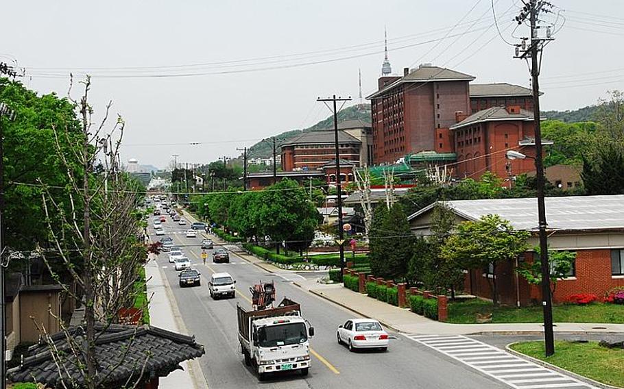 Construction to turn U.S. Army Garrison Yongsan into a park will begin in 2017, according to South Korea's Ministry of Land, Transport and Maritime Affairs. The Dragon Hill Lodge, right, will remain standing after the park is completed. Behind the Dragon Hill is the top of Seoul Tower on Namsan mountain, which will be linked to the park through a greenway.