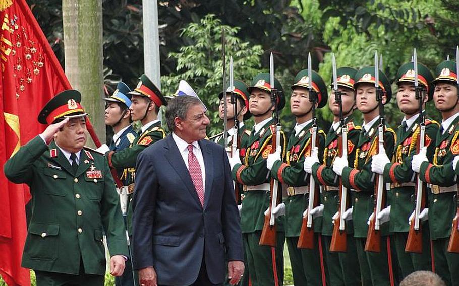 Vietnamese Defense Minister Gen. Phung Quang Thanh salutes as he and Defense Secretary Leon Panetta review Vietnamese troops before a meeting at the Vietnamese Ministry of National Defense on June 4, 21012.
